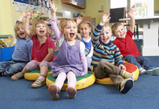 kids raising their hands